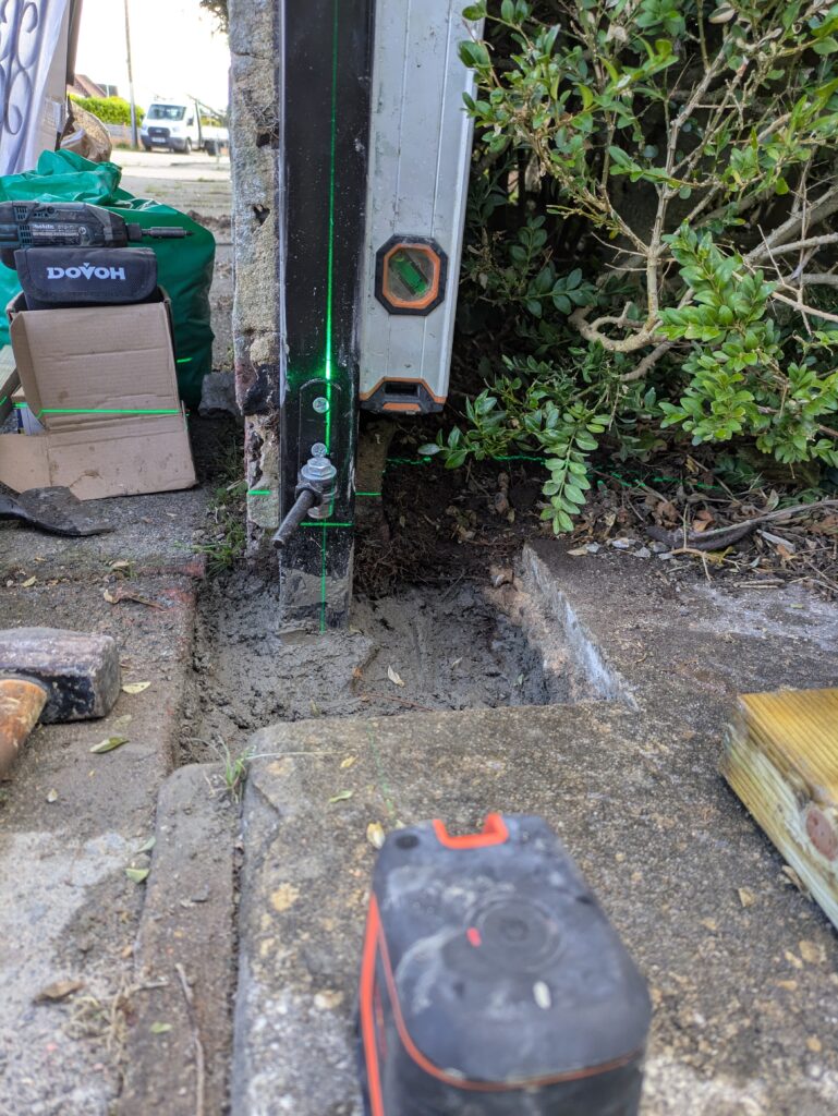 Gate repair in Worthing requires a laser level and magnetic spirit level to ensure the posts are vertical.