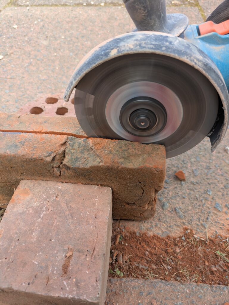 using a stone bladed disc cutter to neat holes in a pathway is essential for gate repair