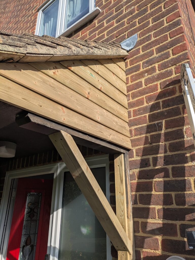 shiplap cladding being fixed to a wooden porch repair in Worthing